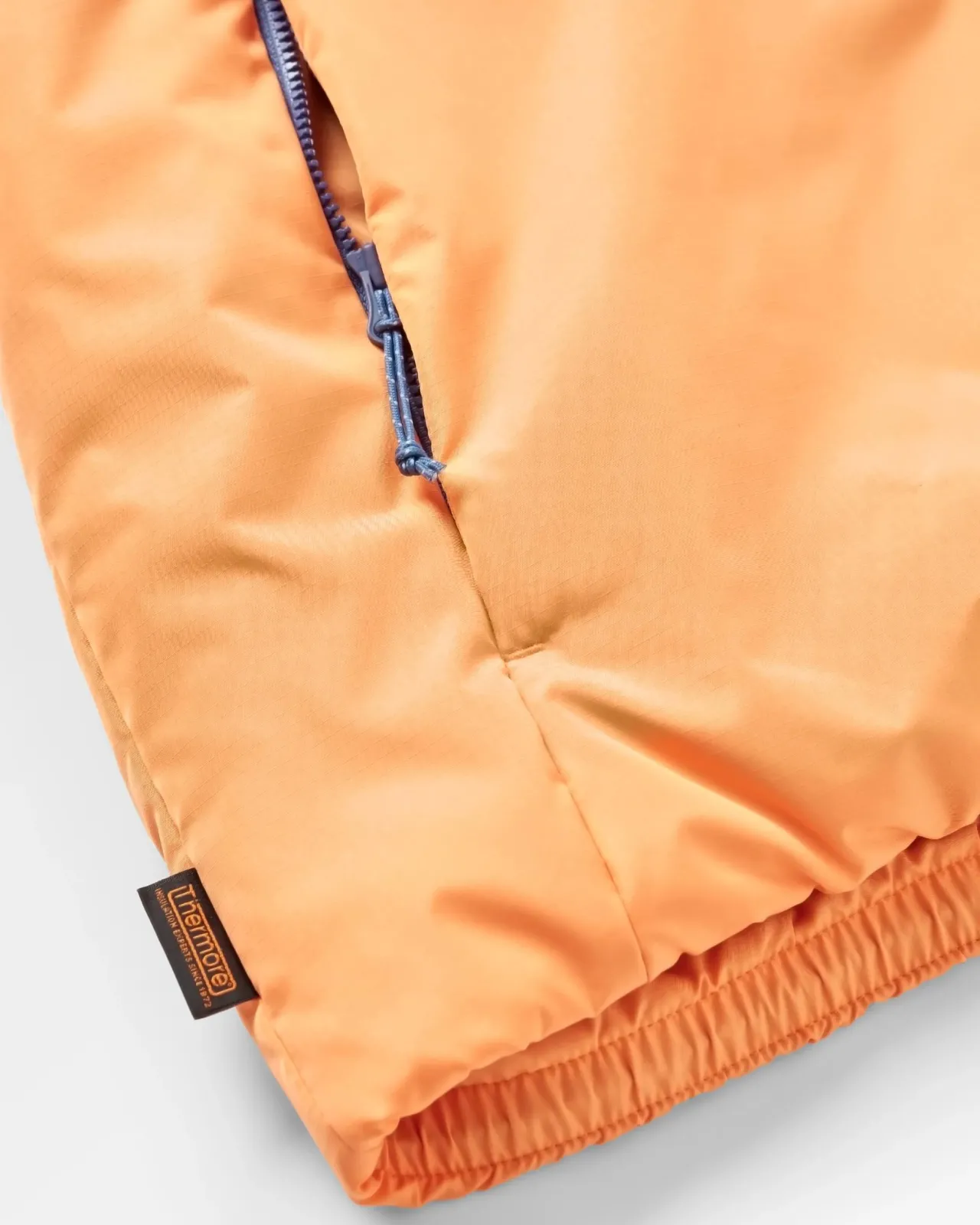 singletrack_recycelte_thermoreisolierjacke__dunkelblauaprikose_9.webp Outlet Singletrack Recycelte Thermore®-Isolierjacke - Dunkelblau/Aprikose Damen Jacken